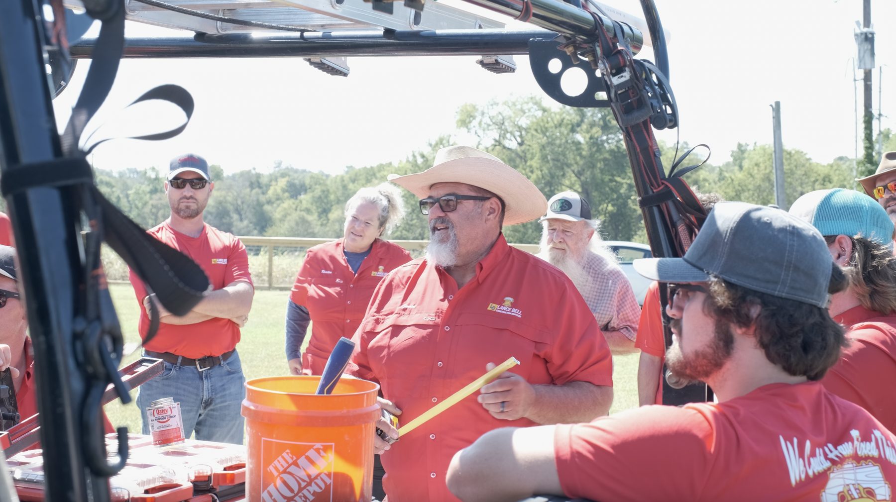 Lance Bell leading a Bell crew briefing at a job site